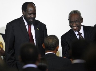 U.S. President Barack Obama (C) greets semi-autonomous South Sudan's President Salva Kiir (L) and Sudan's Vice President Ali Osman Taha (R), before a high level meeting on Sudan, at United Nations headquarters, in New York, September 24, 2010 (Reuters)