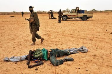 A rebel soldier lies dead while Chad soldiers carry out clearing up operations on May 8, 2009 in the area of Am Dam, 130 km south of Abeché  (Getty)