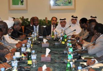 AU-UN mediator for Darfur Djibril Bassole (L) and Qatar’s state FM Ahmed bin Abdullah al-Mahmud, at a meeting with Sudanese and LJM delegations in Doha October 5, 2010. (QNA)