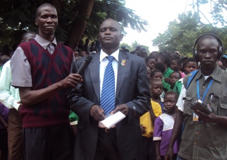 Nzara County Commissioner Mr. Elia Richard Box addresses IDPs at Nzar a settlement camp south Sudan Oct. 2010