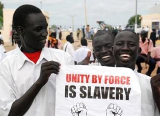 Students from Rumbek University hold a sign saying 'Unity by force is slavery' at a demonstration in Rumbek Lakes state, South Sudan 16 Oct. 2010 (ST)