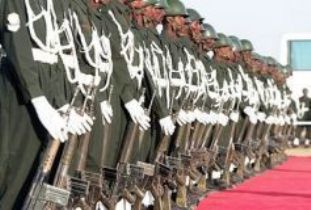 Sudanese army soldiers stand at attention during a a military ceremony August 2007.