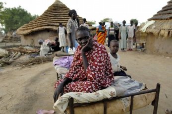 Conflicting SPLM reports about calls by SPLM figures for the NCP to admit that Abyei belong to South Sudan without referendum. A displaced woman waits food distribution in May 2008 (Reuters)