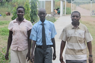 China Paul Mayol (center) his mother (left) and his teacher Cleous Bwambale Tinkasimire in (right), Lakes state, South Sudan (ST)