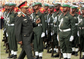 FILE - Sudanese President Omer El-Bashir inspects an honor guard during a celebration marking the 54th army day at the city of Omdurman, near the capital Khartoum, Sudan, Sunday Aug. 17, 2008 (AP)