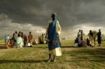 woman displaced by fighting in Abyei in southern Sudan waits for assistance in the village of Agok May 21, 2008. (Reuters)