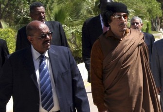 Libya's leader Muammar Al-Gaddafi (R) welcomes Sudan's President Omer Hassan al-Bashir (AP)