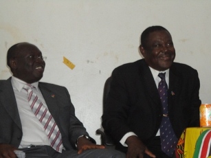 Southern Sudan's Minister for Transport Anthony Lino Makana (Left) and retired General Alison Monani Magaya listening to speeches to celebrate Magaya's defection from NCP to SPLM, Yambio, Western Equatoria, South Sudan, Nov. 10, 2010 (ST)
