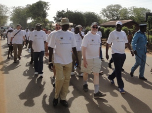 US Acting Consul General in Juba Roger Moran (center) and southern Sudan's Minister of Transport and Roads, Anthony Lino Makana (right), on the walk during the Road Safety parade on Nov. 6, 2010