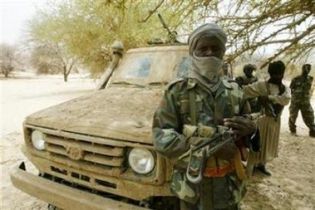 Rebels from the  Justice and Equality Movement (JEM) stand guard near the Chadian border July 8, 2007. (Reuters)