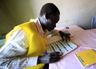 An officer registers the name of a South Sudanese man at a registration centre in Khartoum, November 15, 2010 (Reuters)