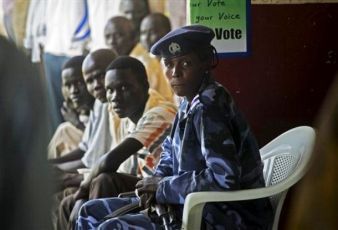 A southern Sudanese police officer provides security during voter registration in the southern town of Melut on Monday, Nov. 15, 2010. (AP)