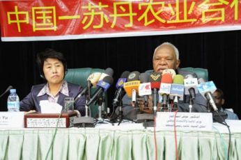 Sudanese Minister of Industry Awad Ahmad al-Jaz (R) and chief economist of Chinese Ministry of Agriculture Zhang Yuxiang (FILE - Xinhua)