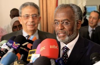 Foreign Minister Ali Ahmad Karti (R)  talks to the press with the visting Arab League chief Arm Moussa upon his arrival in Khartoum on December 28, 2010 (Getty)