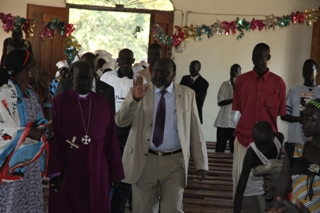Lakes State Governor Chol Tong Mayay (center) arrives at a church gathering in Pacong locality. Dec 26, 2010 (ST)