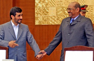 Iranian President Mahmoud Ahmadinejad and Sudan's President Omar Hassan Al-Bashir (Isam Al-Haj/AFP/Getty Images)