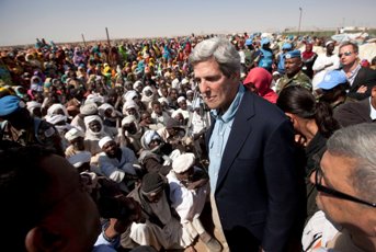 A handout picture released by UNAMID shows US Senator John Kerry with displaced in Shangili Tobayi on January 7, 2011.