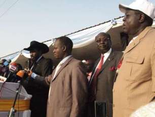 President Salva Kiir addresses journalists after voting in Juba. Also present was Barnaba Marial Benjamin, the Information and Broadcasting minister (2nd right). Jan 9, 2011 (ST)