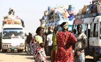 Southern Sudanese families wait to board buses in Mandela area in the outskirts of the capital of Khartoum on January 6, 2011 before returning to their homeland from the north ahead of a key referendum on south Sudan's independence (Getty)