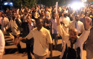 Supporters of Sudanese Islamist opposition leader Hassan al-Turabi march in Khartoum on January 19, 2011 (AFP)