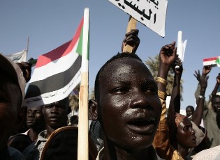 FILE - A supporter of Sudan's President Omar Hassan al-Bashir takes part in a protest with southern Sudanese people against the International Criminal Court  (Reuters)