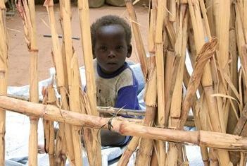 A child looks inside a shelter at Sakale Wali IDPs camp in the South Darfur town of Nyala May 29, 2010. (Reuters)