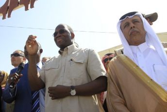 Djibril Bassole (L) and Qatari State Minister for Foreign Affairs Ahmed bin Abdullah Al-Mahmoud (R) stand together during a mediation visit to Zalingi town in west Darfur December 1, 2010 (Reuters)