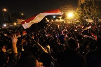 Egyptian anti-government protesters celebrate at Cairo's Tahrir Square after president Hosni Mubarak stepped down on February 11, 2011 (Getty Images)