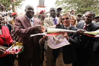 US Consul General R. Barrie Walkley, (C) Anthony Lino Makana (L) and the GOSS Minister of Energy Mining Garang Diing Akoung (C) and W Equaoria GovernorBangasi Joseph Bakosoro  inaugurate the Maridi Power Plant, funded by USAID and implemented by the Louis Berger Group and NRECA on 23 February 2011 (Photo Jenn Warren/USAID)