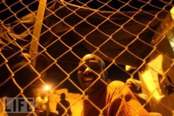 African immigrants under arrest at an Israeli Army base after they managed to cross into Israel on August, 12, 2007, on the Israeli Egyptian border (Getty Images)