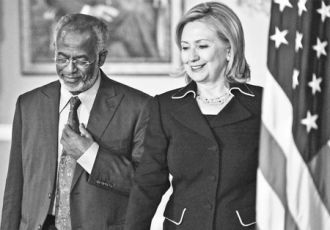 US Secretary of State Hillary Clinton walks with Sudanese Foreign Minister Ali Karti before their bilateral meeting at the State Department on Wednesday in Washington, DC. Tim Sloan / Agence France-Presse