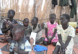 The six returned children on the mat at Panpandiar SPLA headquarters in Jonglei state, South Sudan. From left: Bior Malith Kelei, Abipini Ujulu Oman, Garang Joh Garang ,Leek Malith Kelei, Nyibol Malith Kelei and Ayen Makor Garang. Feb 5, 2011. (ST)