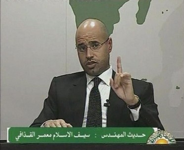 Saif al-Islam, son of Libyan leader Muammar Gaddafi, gestures as he speaks during an address on state television in Tripoli, in this still image taken from video, February 20, 2011 (Reuters)