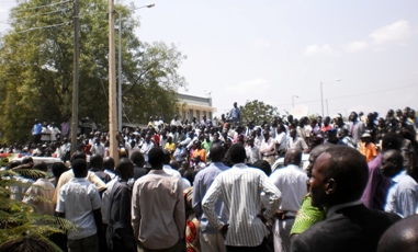 Shocked onlookers who jammed the ministry's premises after news of the morning shooting, Feb. 09, 2011 (ST)