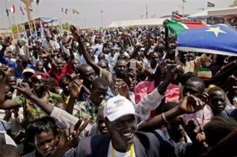 Southern Sudanese celebrate the announcement of preliminary referendum results in the southern capital of Juba on Sunday, Jan. 30, 2011. (AP)