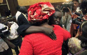 Women from Southern Sudan congratulate one another after the announcement of the official voting results at the Friendship Hall in Khartoum February 7, 2011 (Reuters)