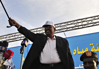 Sudan's President Omar Hassan al-Bashir waves to the crowd during a rally in Kararey locality at Omdurman February 16, 2011 (Reuters)