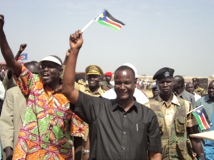 Unity state governor Taban Deng waves the South Sudan flag recognizing the final results of the South's independent vote in Bentui. Feb 8, 2011 (ST)