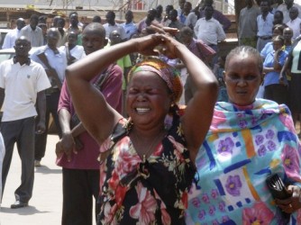 A woman wails outside the compound of South Sudan's Ministry for Rural Development and Cooperatives after the killing of Minister Jimmy Lemi at the ministry compound in Juba February 9, 2011. (Reuters)