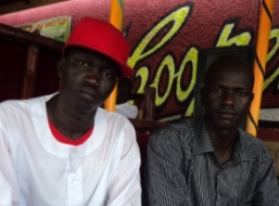Artist ‘Dan Joyling’ (left) explains to the ST's Philip Thon (right) why young South Sudanese musicians use aliases. Kampala, Uganda. March 8, 2011 (ST)