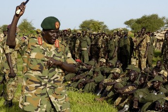FILE - A handout picture released by the United Nations Mission in Sudan (UNMIS) shows SPLA (Sudan People's Liberation Army) Major General Peter Gadet (L) addressing his troops prior to their withdrawal from Abyei on July 2, 2008 in line with the 