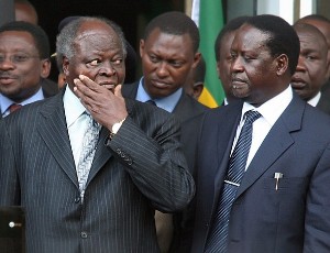 Kenyan President Mwai Kibaki (L) looks at Kenya's PM Raila Odinga (AFP)