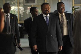 Chairman of the Commission of the African Union Jean Ping (L) chats with Tanzanian president Jakaya Kikwete (R) in Addis Ababa on March 9, 2011 (Reuters)