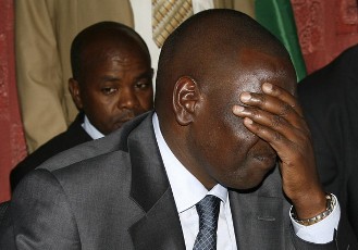 FILE - Kenya's suspended higher education minister William Ruto reacts during a news conference in the capital Nairobi December 15, 2010 (Reuters)