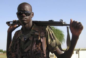 A SPLA soldier stands guard at a U.N. base in Abyei May 16, 2008 (Reuters)