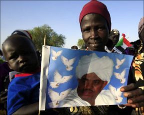 A south Sudanese woman holding a poster of Sudan president Omar Al-Bashir (Sudan TV website)