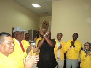 Taban Deng Gai receiving a trophy from WNPOC staffs for the celebration a nation at Tharjath oil production company base (ST)
