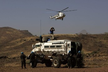 Peacekeepers from UNAMID stand guard during a visit by Ibrahim Gambari, the civilian head of UNAMID at Jawa village in east Jebel Marra (South Darfur), 9 km (6 miles) West Deribat March 18, 2011 (Reuters)