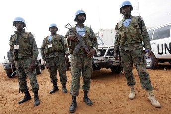 FILE - UNAMID soldiers guard a high-level meeting with Chinese, European, United Nations and African Union officials in El-Fasher, the capital of North Darfur on July 5, 2010 (AFP)