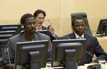 In a photo taken on June 17, 2010, Abdallah Banda Abakaer Nourain (C) and Saleh Mohammed Jerbo Jamus (R), suspected of having committed war crimes in Darfur, Sudan arrived voluntarily at the International Criminal Court in The Hague (AFP)